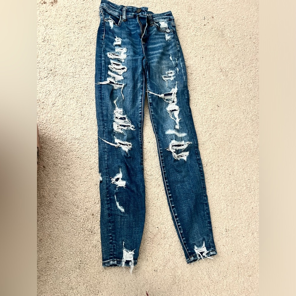 American eagle jeans, less holed pair is 0 regular, more holed pair is 00 long